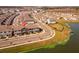 Aerial view of community showcasing home's location by lake at 2559 Relaxing Ln, Kissimmee, FL 34747