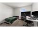 Bedroom with twin bed, desk, and large TV at 2559 Relaxing Ln, Kissimmee, FL 34747