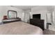 Bedroom with large bed, dresser, and ensuite bathroom at 2559 Relaxing Ln, Kissimmee, FL 34747