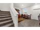 Small dining area with table and chairs near staircase at 2559 Relaxing Ln, Kissimmee, FL 34747