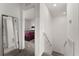 Upstairs hallway with mirror and bedroom access at 2559 Relaxing Ln, Kissimmee, FL 34747
