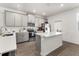 Modern kitchen with gray cabinets, white countertops, and an island at 2559 Relaxing Ln, Kissimmee, FL 34747