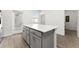 Kitchen island with white countertop and gray cabinets at 2559 Relaxing Ln, Kissimmee, FL 34747