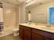 Bathroom with double vanity, tub and shower at 2646 River Landing Dr, Sanford, FL 32771