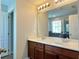 Double vanity bathroom with large mirror and ample storage at 2646 River Landing Dr, Sanford, FL 32771
