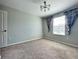 Bright bedroom with carpeted floor, window, and neutral walls at 2646 River Landing Dr, Sanford, FL 32771