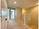 Upstairs hallway with carpet, doors to bedrooms, and attic access at 2646 River Landing Dr, Sanford, FL 32771