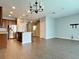 Open living room and kitchen area with tile floors at 2646 River Landing Dr, Sanford, FL 32771
