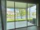 Screened-in patio overlooking a peaceful lake at 2646 River Landing Dr, Sanford, FL 32771