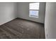Carpeted bedroom with a bright window providing natural light at 2713 Runners Cir, Clermont, FL 34714