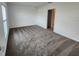 Bedroom with neutral carpet and view of door to ensuite bath at 2713 Runners Cir, Clermont, FL 34714