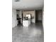Open-concept kitchen featuring a large island, stainless steel appliances, and white cabinetry at 2713 Runners Cir, Clermont, FL 34714