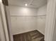 Walk-in closet with metal shelving and neutral carpet at 2713 Runners Cir, Clermont, FL 34714