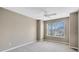 Bedroom with ceiling fan and large window at 2717 Treymore Dr, Orlando, FL 32825