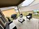 Back patio featuring outdoor seating, a grill, well-kept grass, and a gray cat at 2931 Top Water Way, Kissimmee, FL 34746