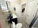 Cozy bathroom featuring a vanity with sink, toilet, and a shower with a partial view of the interior at 2931 Top Water Way, Kissimmee, FL 34746