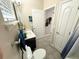 Bathroom with a dark vanity, marbled countertop and tile flooring at 2931 Top Water Way, Kissimmee, FL 34746