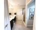 This bathroom features double sinks and a walk-in shower with a glass door at 2931 Top Water Way, Kissimmee, FL 34746