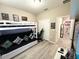 Neutral-toned bedroom with a bunk bed and a workspace next to a set of double closets at 2931 Top Water Way, Kissimmee, FL 34746