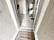 Cozy entryway featuring a 'Welcome' mat, inviting guests into a home with neutral tones and tiled flooring at 2931 Top Water Way, Kissimmee, FL 34746