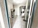 View of the home's entryway featuring an open doorway with tile flooring and neutral decor at 2931 Top Water Way, Kissimmee, FL 34746