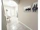 Elegant entryway showcasing tiled floors, a modern light fixture, and stylish decor accents throughout the home at 2931 Top Water Way, Kissimmee, FL 34746