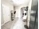 Inviting entryway with neutral tones, featuring decorative lighting, contemporary decor, and tiled flooring at 2931 Top Water Way, Kissimmee, FL 34746