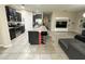 Spacious kitchen island with dark cabinetry and modern stainless steel appliances at 2931 Top Water Way, Kissimmee, FL 34746