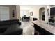 Open-concept living and dining area featuring tile flooring, modern furnishings, and contemporary decor at 2931 Top Water Way, Kissimmee, FL 34746