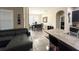 Open-concept living and dining area with tile floors, modern furniture, and natural light at 2931 Top Water Way, Kissimmee, FL 34746