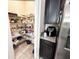Walk-in pantry with organized shelving, stocked with various food items and supplies at 2931 Top Water Way, Kissimmee, FL 34746
