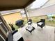 Outdoor patio with seating, a grill, and a view of the backyard, perfect for relaxing and entertaining at 2931 Top Water Way, Kissimmee, FL 34746