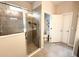 This bathroom features a glass-enclosed shower, tile flooring, and neutral walls at 2931 Top Water Way, Kissimmee, FL 34746