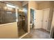 This bathroom features a glass-enclosed shower, tile flooring, and neutral walls at 2931 Top Water Way, Kissimmee, FL 34746