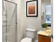 Bathroom with a shower, toilet, and a vanity with a mirror at 3002 Red Ginger Rd, Kissimmee, FL 34747
