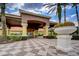 Welcoming entrance of Encantada featuring well-maintained landscaping, decorative columns and elegant signage at 3002 Red Ginger Rd, Kissimmee, FL 34747
