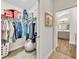 Well-organized walk-in closet with shelves, hanging rods, and access to the bathroom at 3065 Sentell St, The Villages, FL 32163