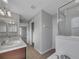 Bathroom with double vanity and shower at 3124 Oak Brook Ln, Eustis, FL 32736