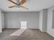 Large bedroom with ceiling fan and neutral carpeting at 3124 Oak Brook Ln, Eustis, FL 32736