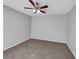 Bright bedroom with ceiling fan and neutral carpeting at 3124 Oak Brook Ln, Eustis, FL 32736