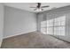Spacious bedroom with ceiling fan and neutral carpeting at 3124 Oak Brook Ln, Eustis, FL 32736