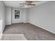 Well-lit bedroom with ceiling fan and neutral carpeting at 3124 Oak Brook Ln, Eustis, FL 32736