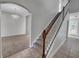 Grand entryway with a staircase, tiled floors, and a chandelier at 3124 Oak Brook Ln, Eustis, FL 32736