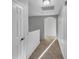 Bright hallway with carpet and access to other rooms at 3124 Oak Brook Ln, Eustis, FL 32736