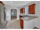 Modern kitchen featuring stainless steel appliances and wood cabinets at 3124 Oak Brook Ln, Eustis, FL 32736