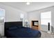 Spacious bedroom with a large bed, nightstand, and window coverings at 361 Preserve Pointe Blvd, Davenport, FL 33837