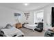 Bright bedroom with two twin beds, neutral walls, soft carpet, and a bright window at 361 Preserve Pointe Blvd, Davenport, FL 33837
