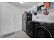 Convenient laundry room with washer, dryer, and extra storage at 361 Preserve Pointe Blvd, Davenport, FL 33837