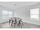 Dining area with white table, chairs, and gray flooring at 361 Preserve Pointe Blvd, Davenport, FL 33837