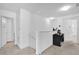Upstairs hallway with built-in workspace and access to bedrooms and bathroom at 361 Preserve Pointe Blvd, Davenport, FL 33837